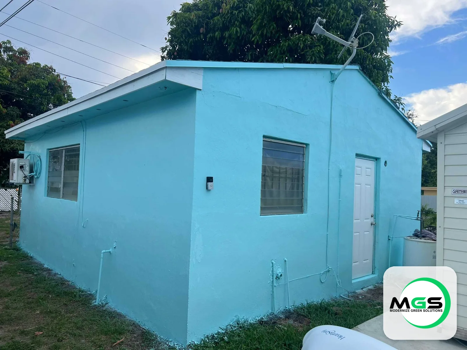 Exterior repaint in blue by Modernize Green Solutions