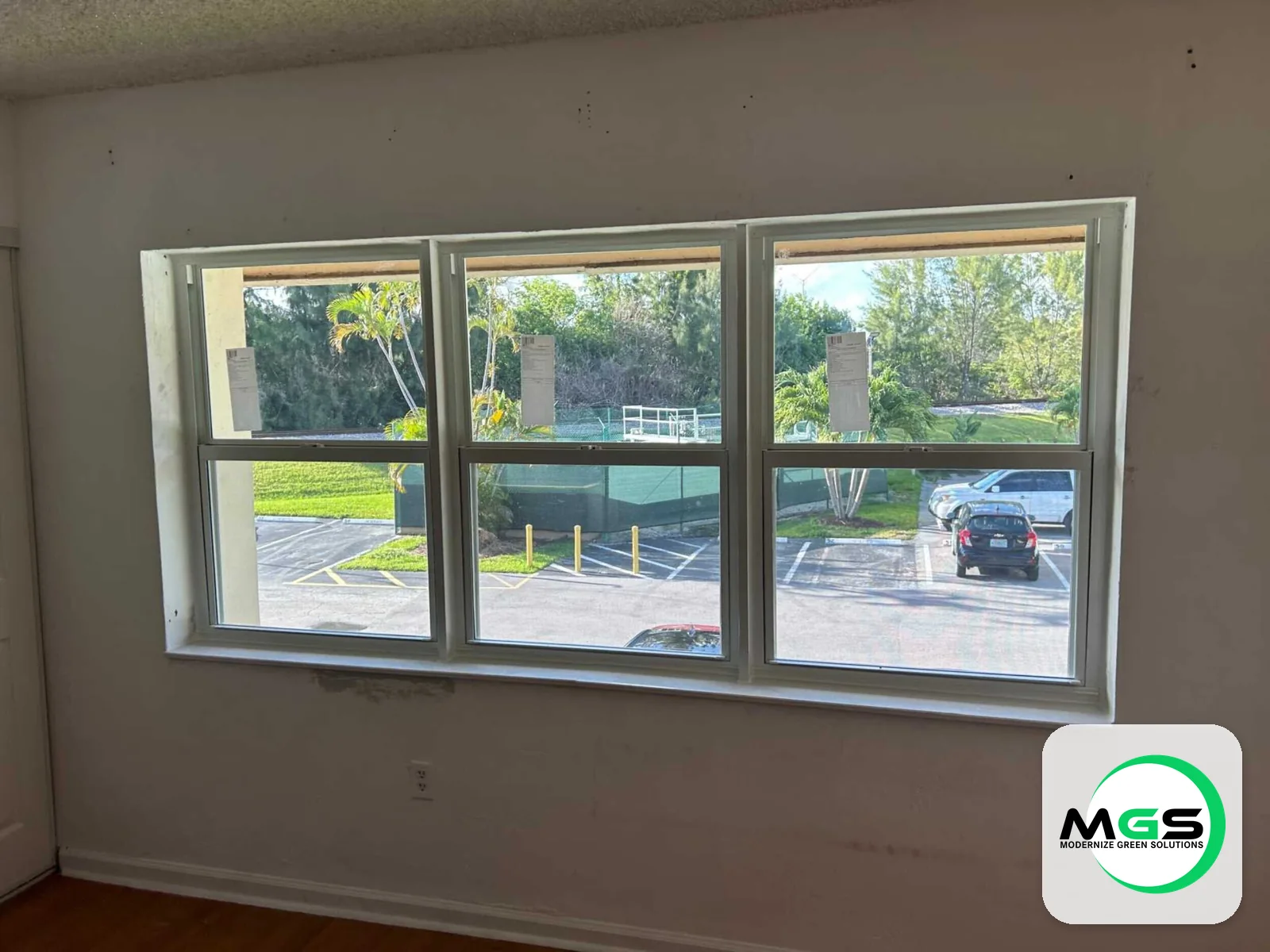 Impact windows in a living room by Modernize Green Solutions